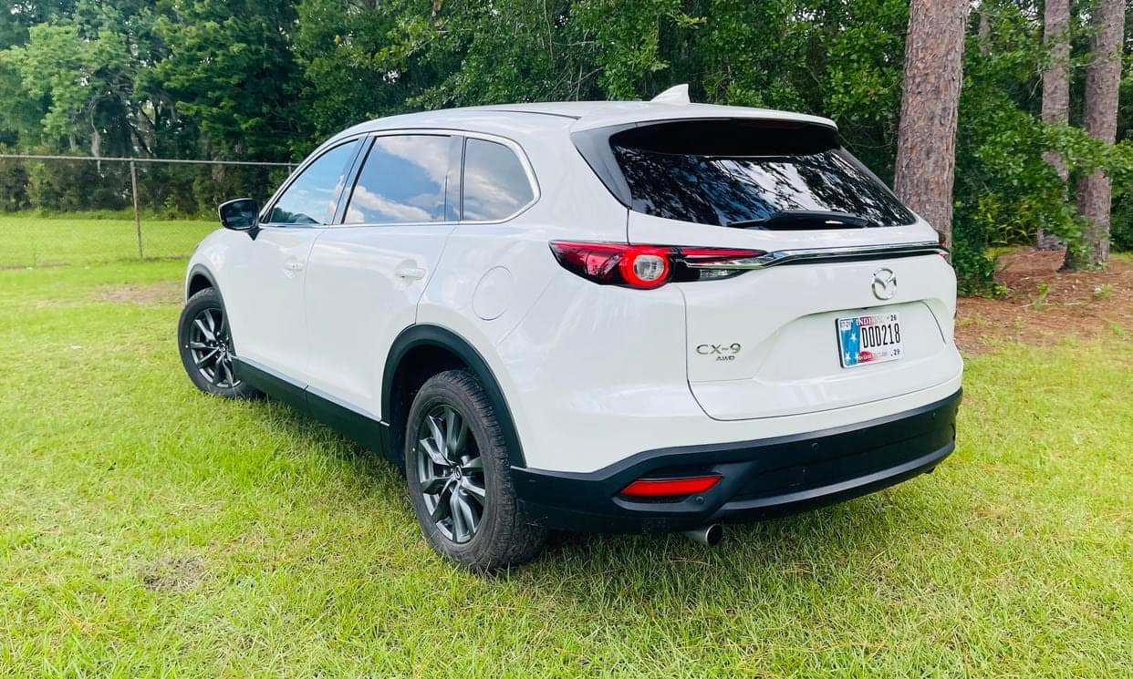 Rear three-quarter view of the white Mazda CX-9