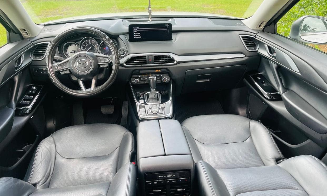 Mazda CX-9 dashboard, leather seats, and center console