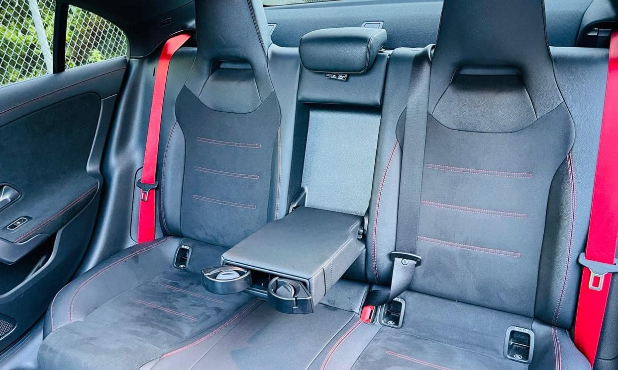Rear seats of the Mercedes-Benz CLA with fold-down armrest and cup holders