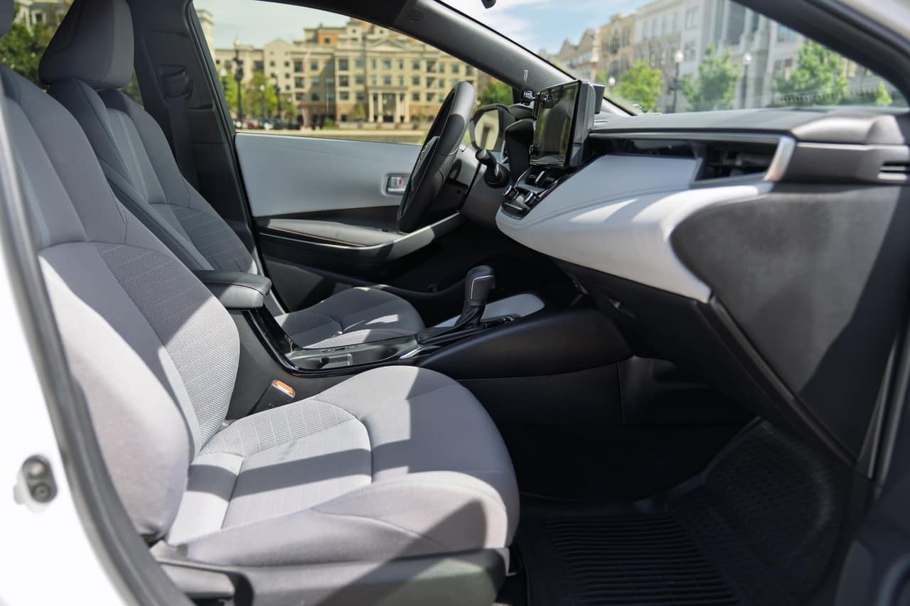 Toyota Corolla front seats and center console viewed from the passenger side