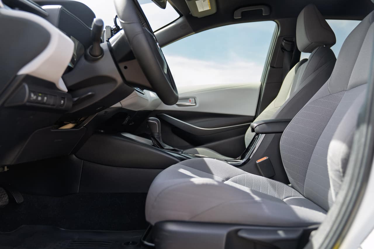 Toyota Corolla driver seat beside the steering wheel and center console