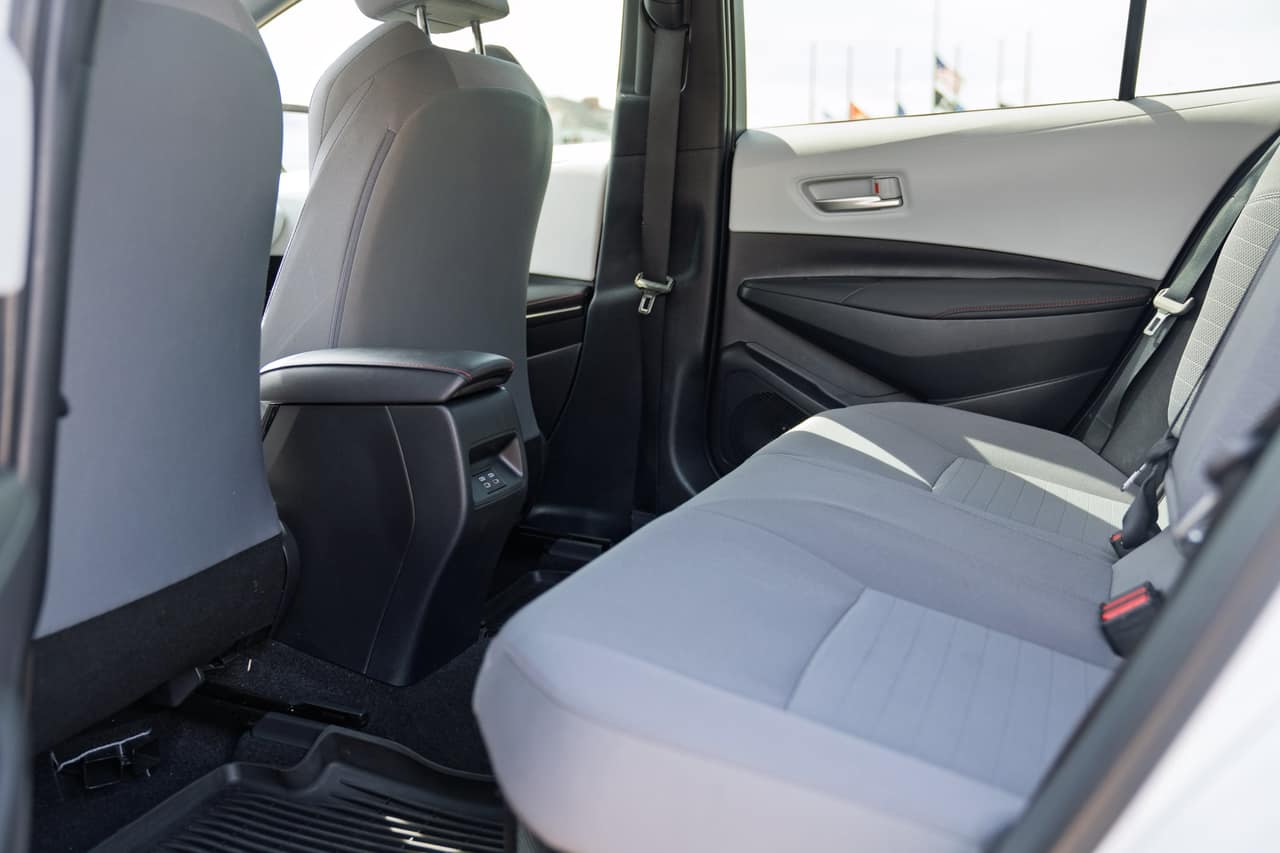 Toyota Corolla rear bench and door panel viewed through the open rear door