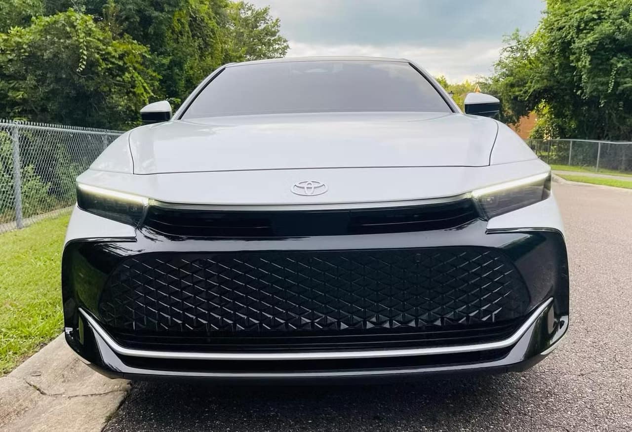 Front view of the Toyota Crown with its black grille and slim LED lights